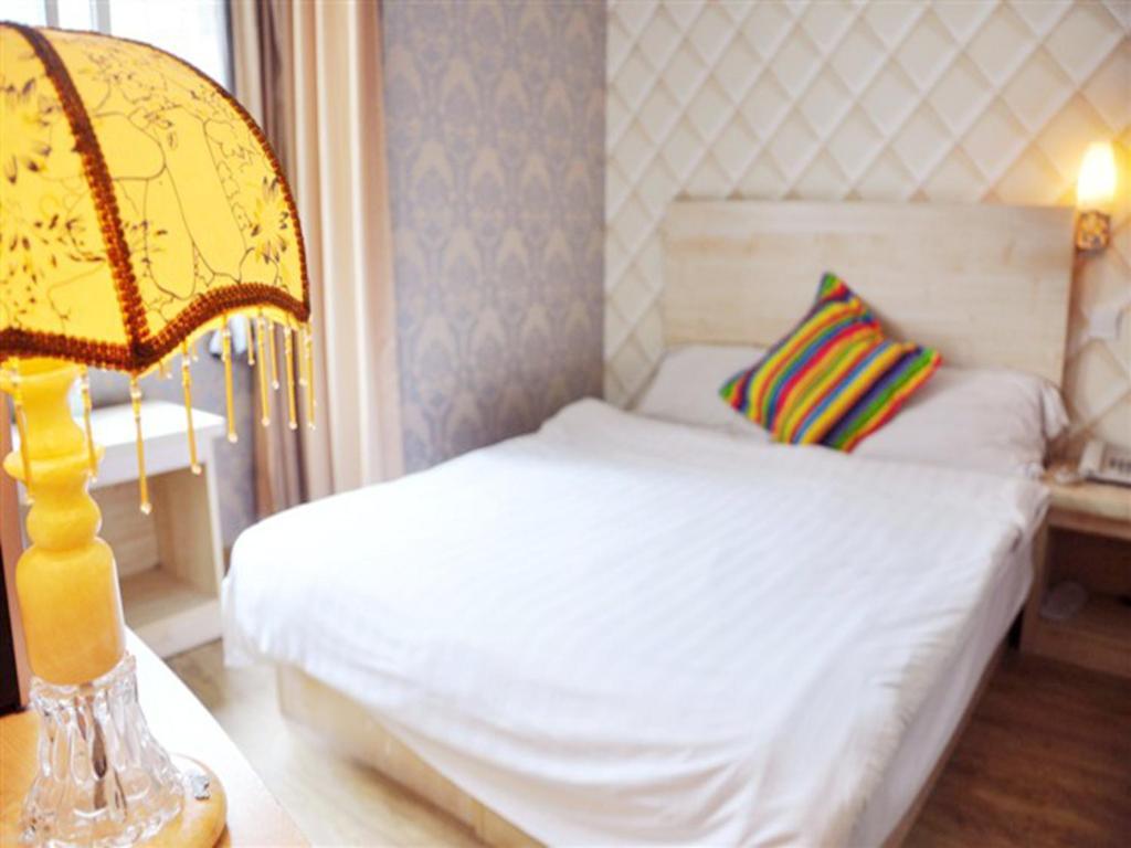 Qingdao Four Seasons Sunshine Business Hotel Zimmer foto